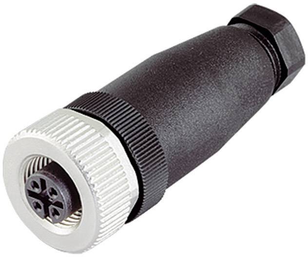 A black electric plug with a silver ring at one end and four holes in the centre for connection.
