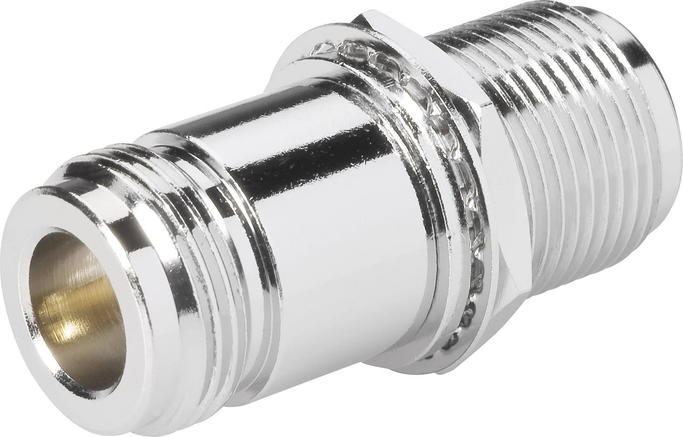 Silver metal adapter with an external thread on the right side and an internal thread on the left side, for connecting hoses.