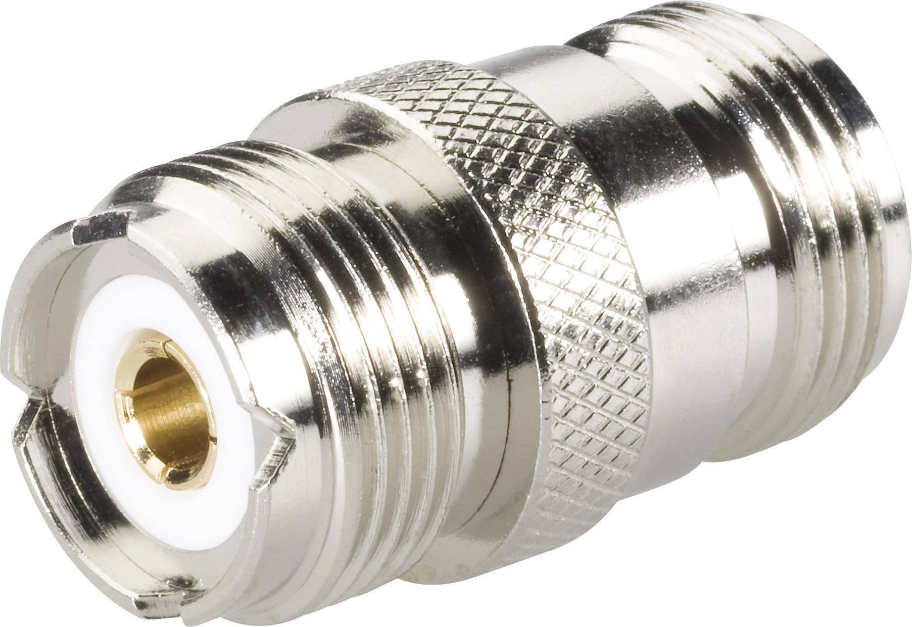 A silver coaxial plug adapter with a knurled grip.