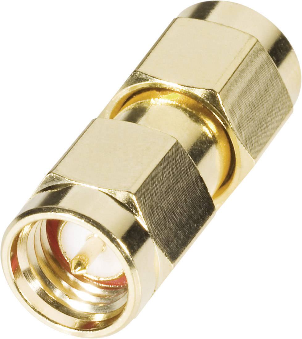 A golden coaxial connector adapter with metal accentuations. Primarily used for electronic connections and signal transmissions.