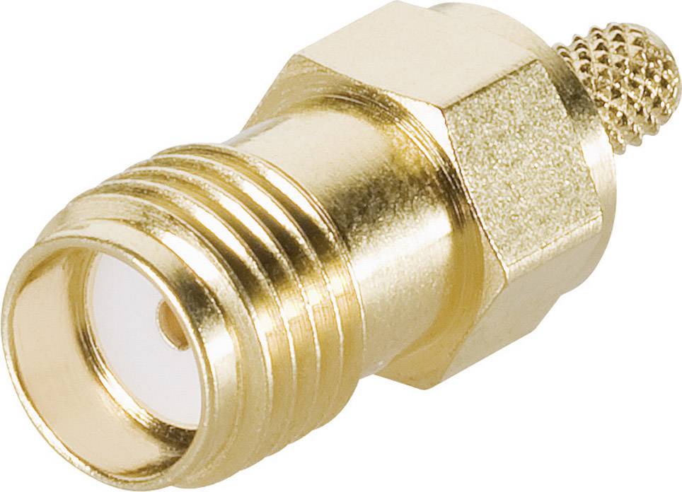 A golden coaxial adapter with a hexagonal nut and knurled end is used for connecting electrical cables.