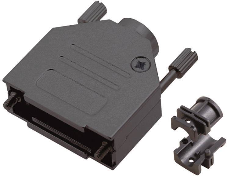 A black plastic housing for an electrical connector, with two screw fastenings, lies beside a small component.