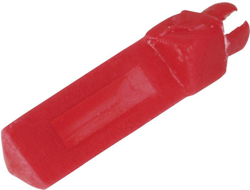 Red wax of a cheese coating, typically encasing a round shape.