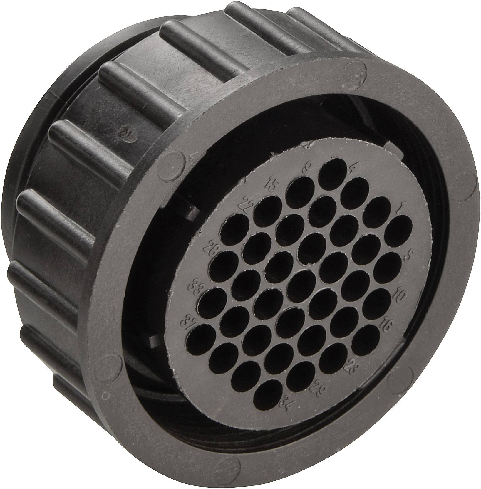 A round black component with many small holes arranged radially in the centre. Potentially a mechanical or electrical part.