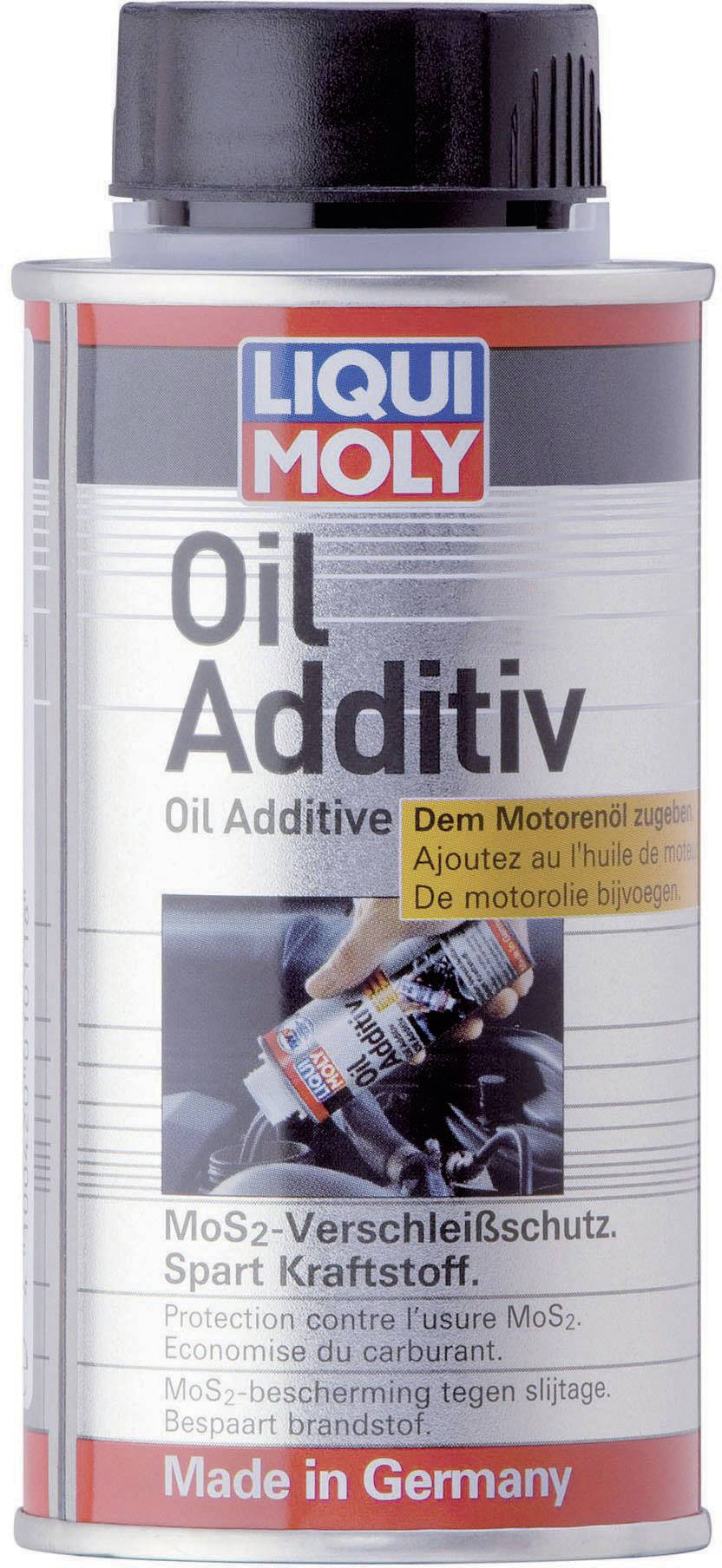 A bottle of Liqui Moly oil additive. Label reads: 'Add to engine oil. MoS2 wear protection. Saves fuel.' Manufactured in Germany.
