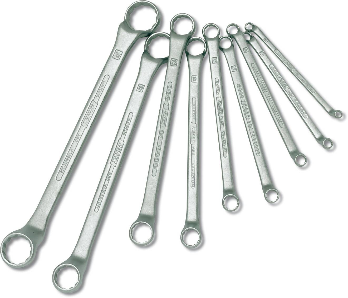 Eight ring spanners of different sizes are laid side by side, arranged from small to large. They are made of shiny metal.