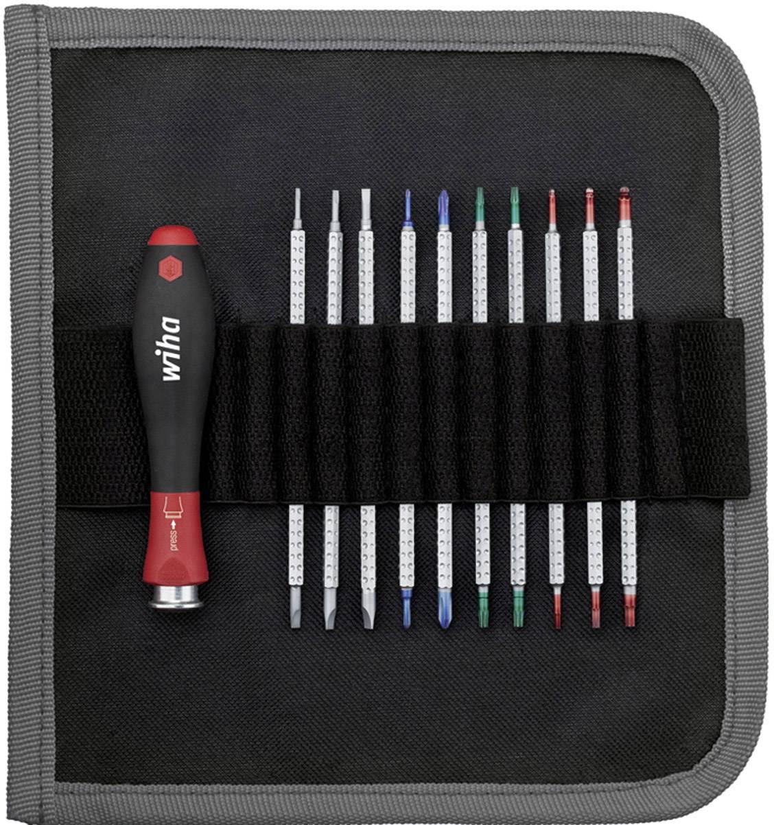 A screwdriver set with various attachments in a black case, the screwdriver having a red and black handle.