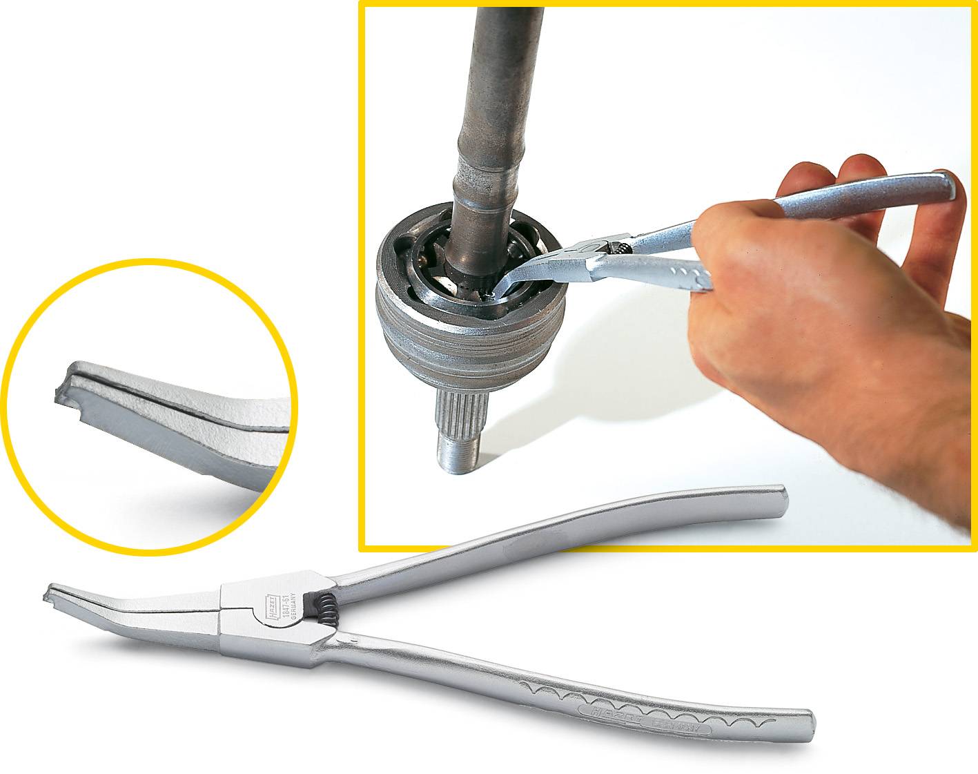 A hand is holding a circlip plier to remove a circlip from a metal shaft. Close-up of the plier tip on the left.