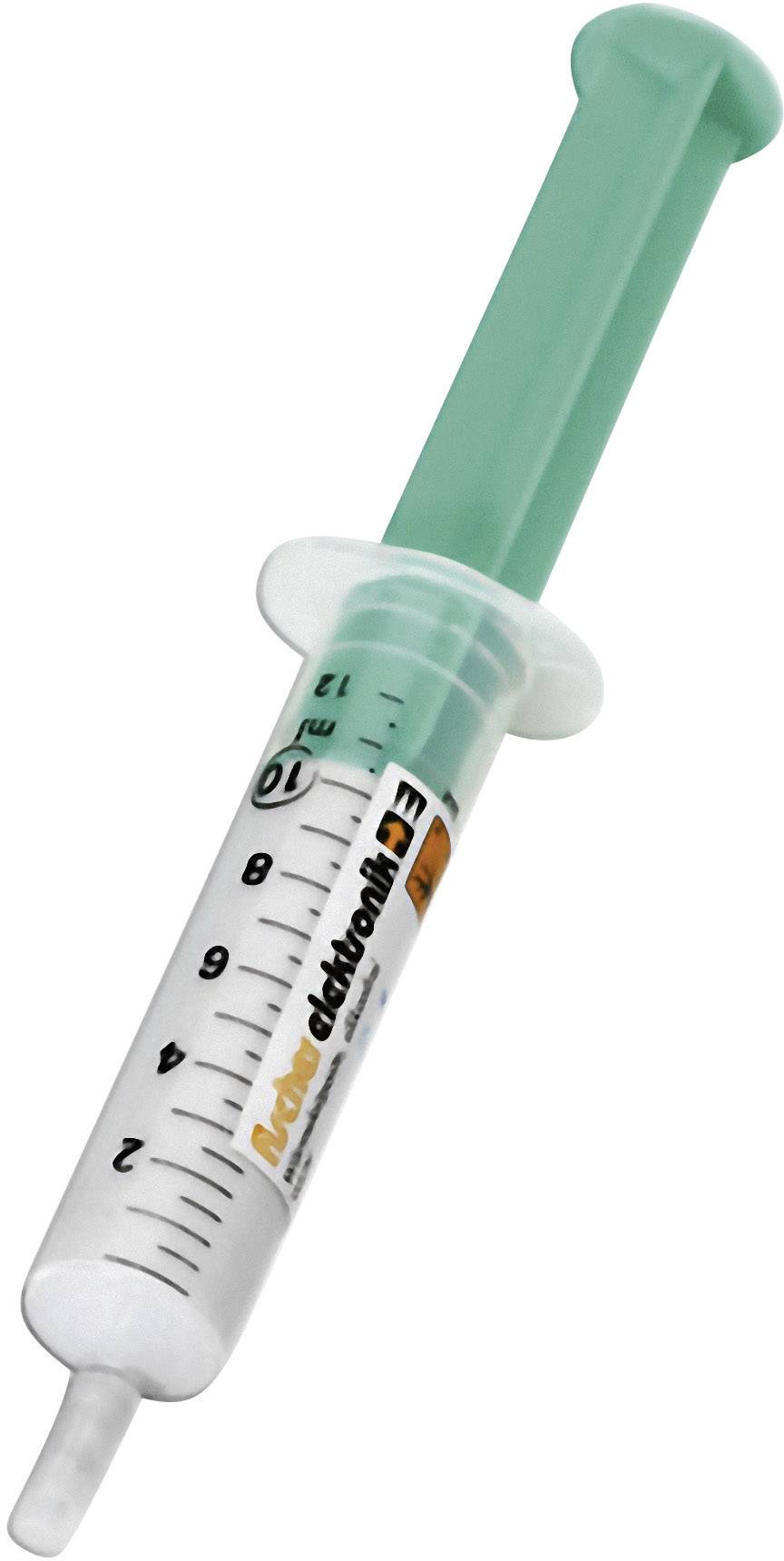 A white syringe with a green cap, marked with a scale and lettering on the side, is lying sideways.