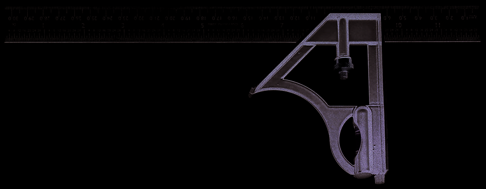 Triangular combination set square with spirit level and ruler.
