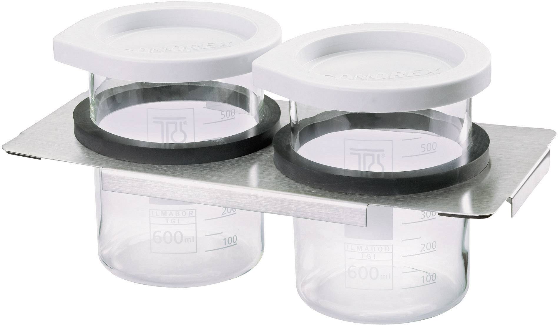 Two glass containers with white plastic lids, both with measurement lines from 100 to 600 ml, are standing in a metal holder.