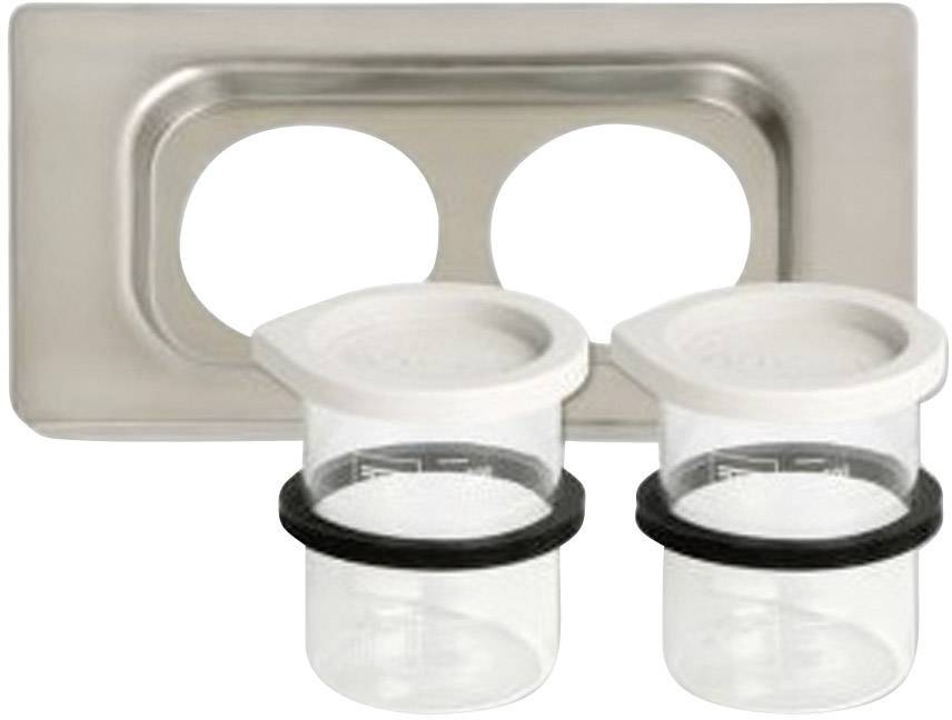 Two transparent plastic containers with white lids and black rubber seals, positioned next to a silver metal bracket with two recesses.