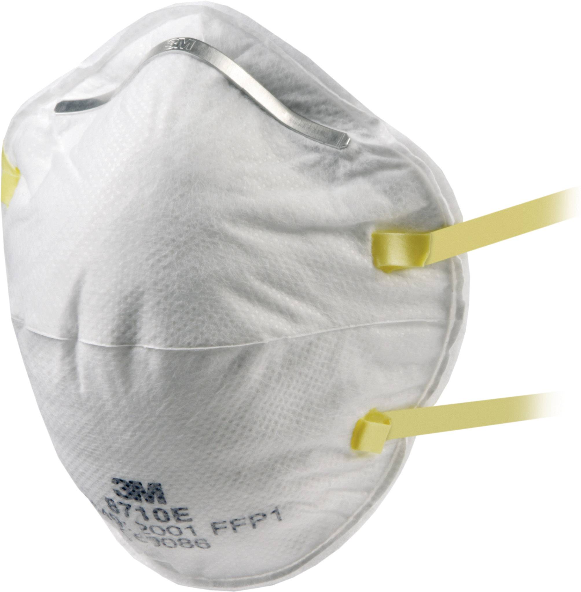 A white respiratory mask with yellow elastic bands, worn for protection against airborne particles.
