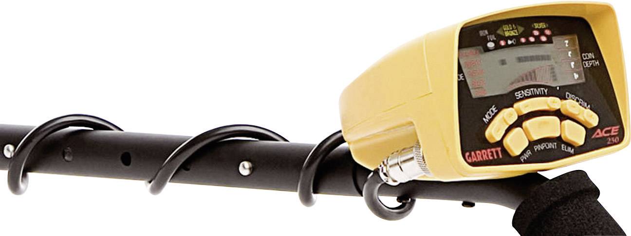 A yellow metal detector with a digital display and multiple control buttons, mounted on a black handle.