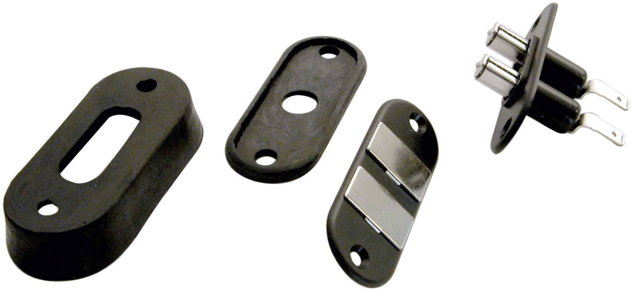 Four distinctly shaped, black and metallic parts, which are to be understood as electrical or mechanical components.