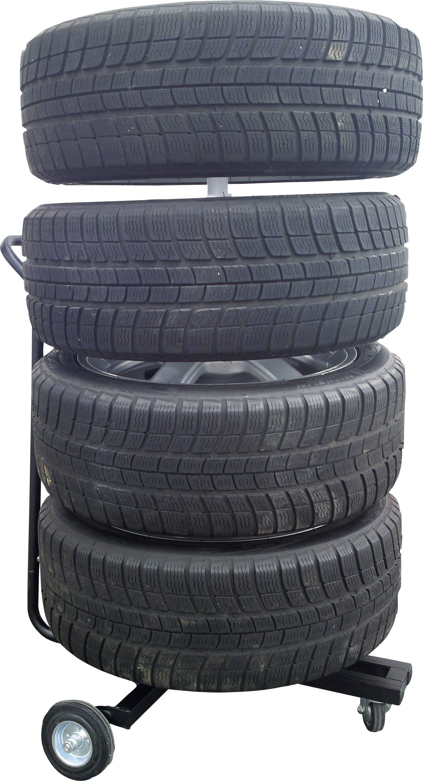 Six black car tyres are stacked on a trolley used for transportation in a workshop.
