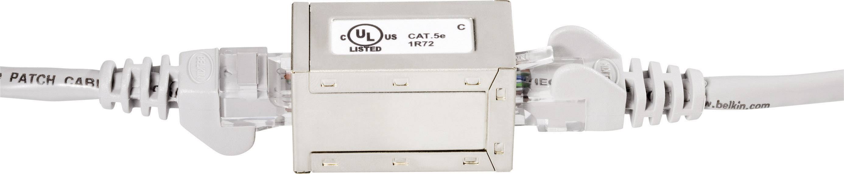 Network cable connector made of metal with two connected Ethernet cables. The label 'CAT 5e PATCH CABLE' is visible on the left.