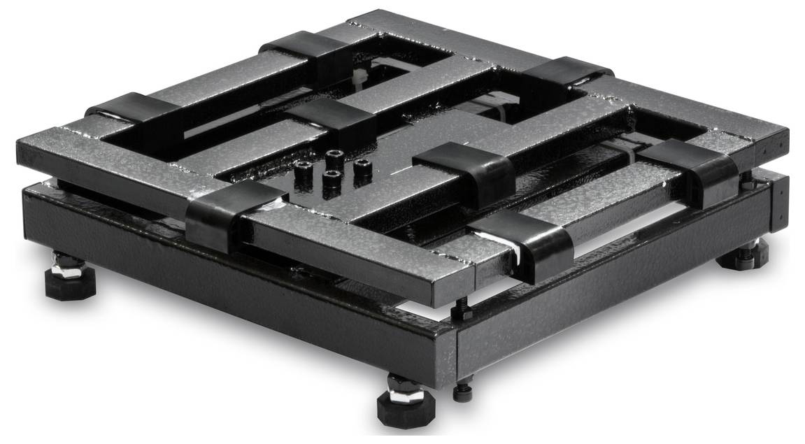 Plateforme carrée noire avec motif quadrillé et pieds réglables, sans fonction apparente.