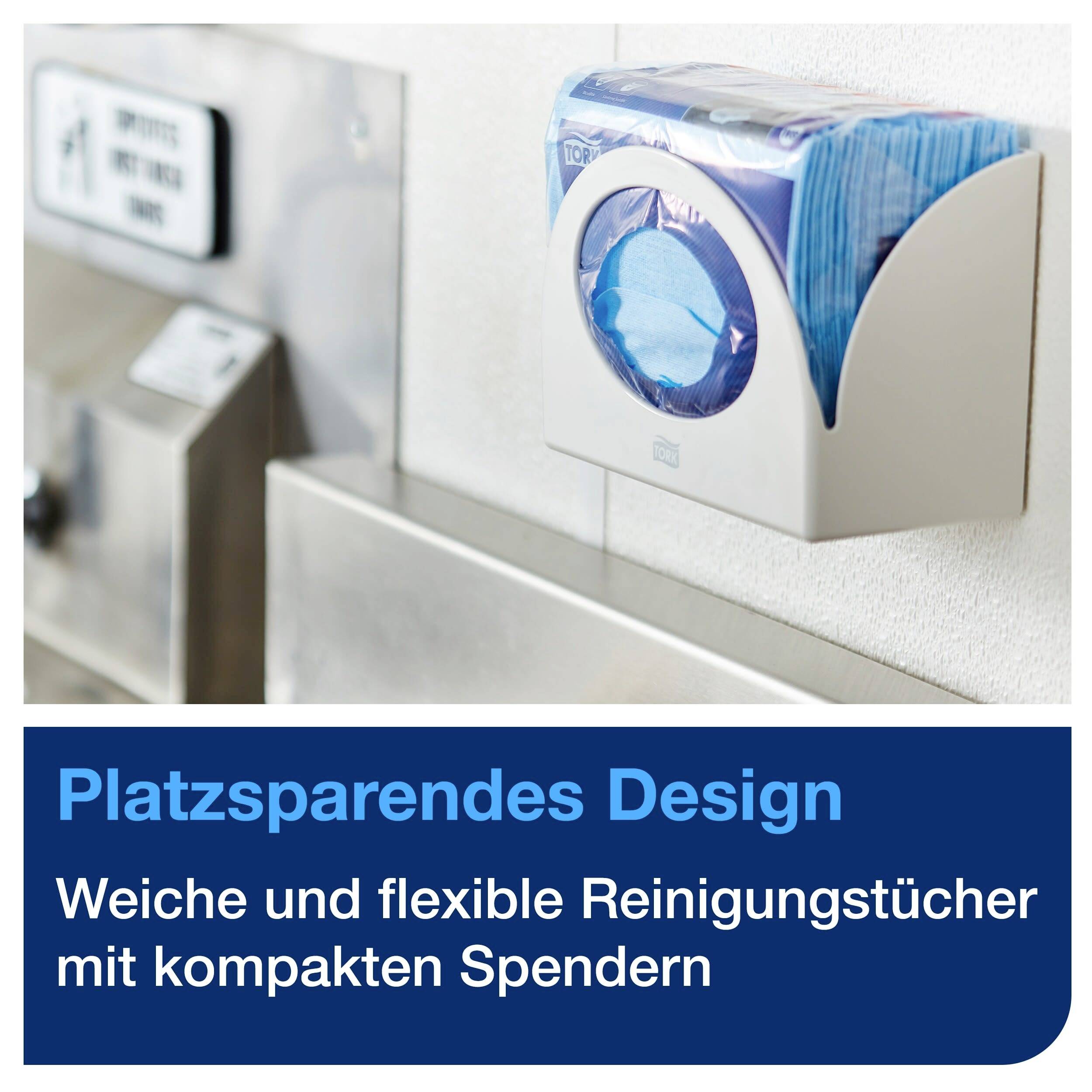 Un distributeur compact de lingettes de nettoyage fixé au mur. Texte dans l'image : 'Design économe en espace. Lingettes de nettoyage douces et flexibles avec des distributeurs compacts'.