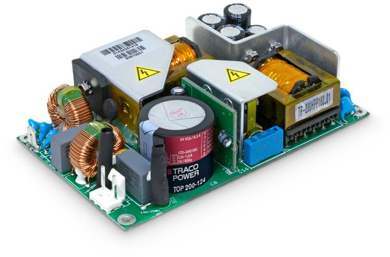 Carte de circuit imprimé avec des composants électroniques tels que des condensateurs, des bobines et des dissipateurs thermiques. Étiquetée avec 'Traco Power' et des symboles d'avertissement.