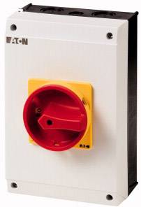 Interrupteur industriel avec bouton rotatif rouge sur fond jaune, monté dans un boîtier gris.