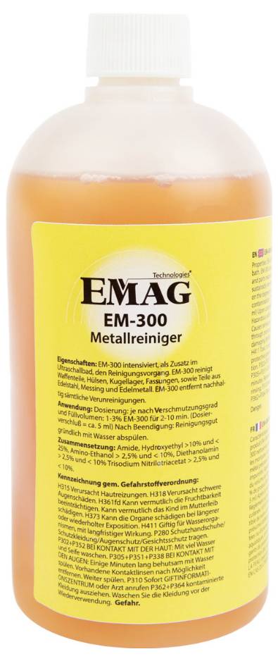 Nettoyant chrome à cinq composants 'EMAG EM-300', liquide jaunâtre dans un flacon transparent, étiquette avec instructions d'utilisation et précautions de sécurité.