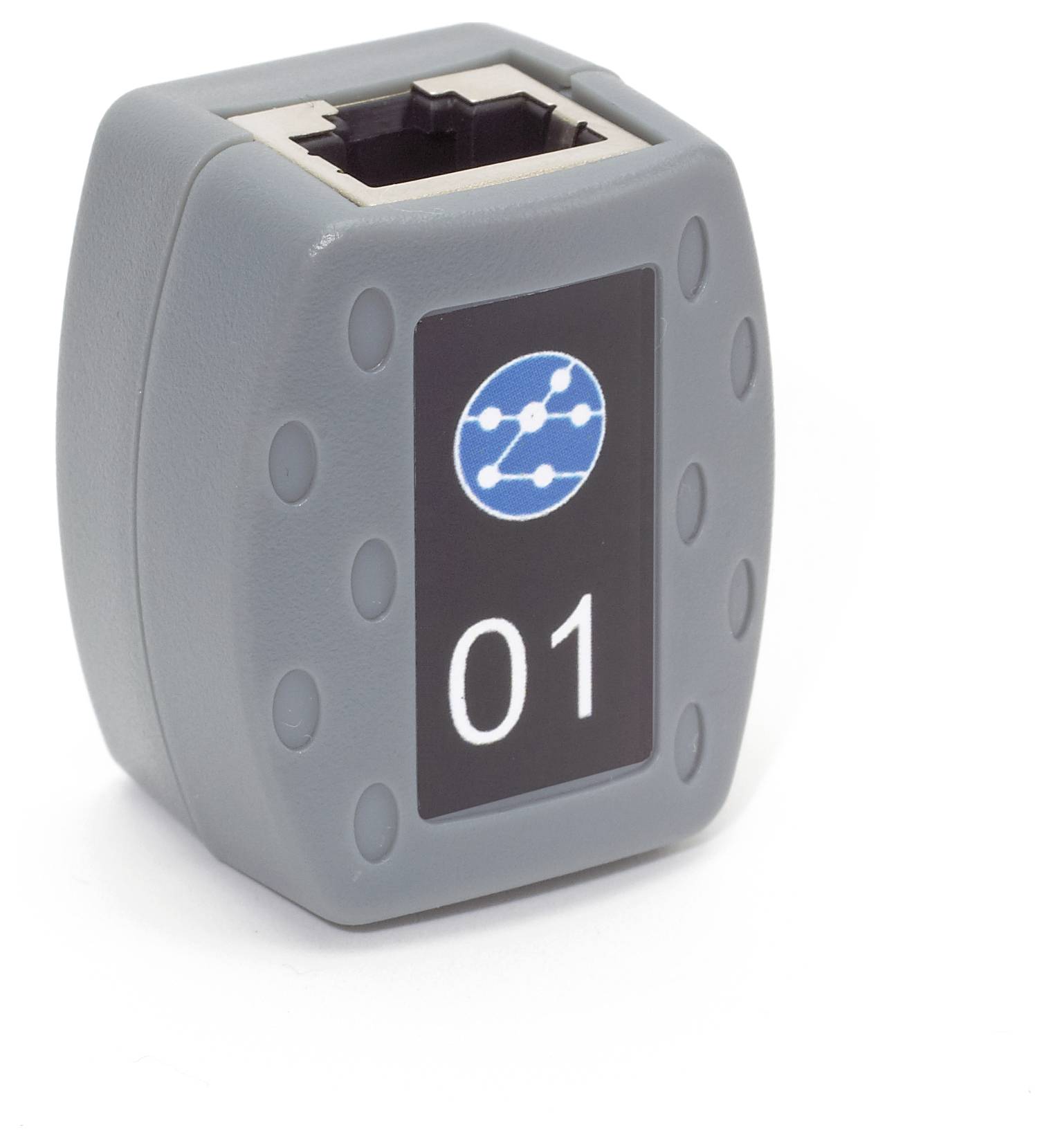Boîtier plastique rectangulaire gris avec symbole de réseau et chiffre '01', probablement un organisateur ou une étiquette de câble Ethernet.
