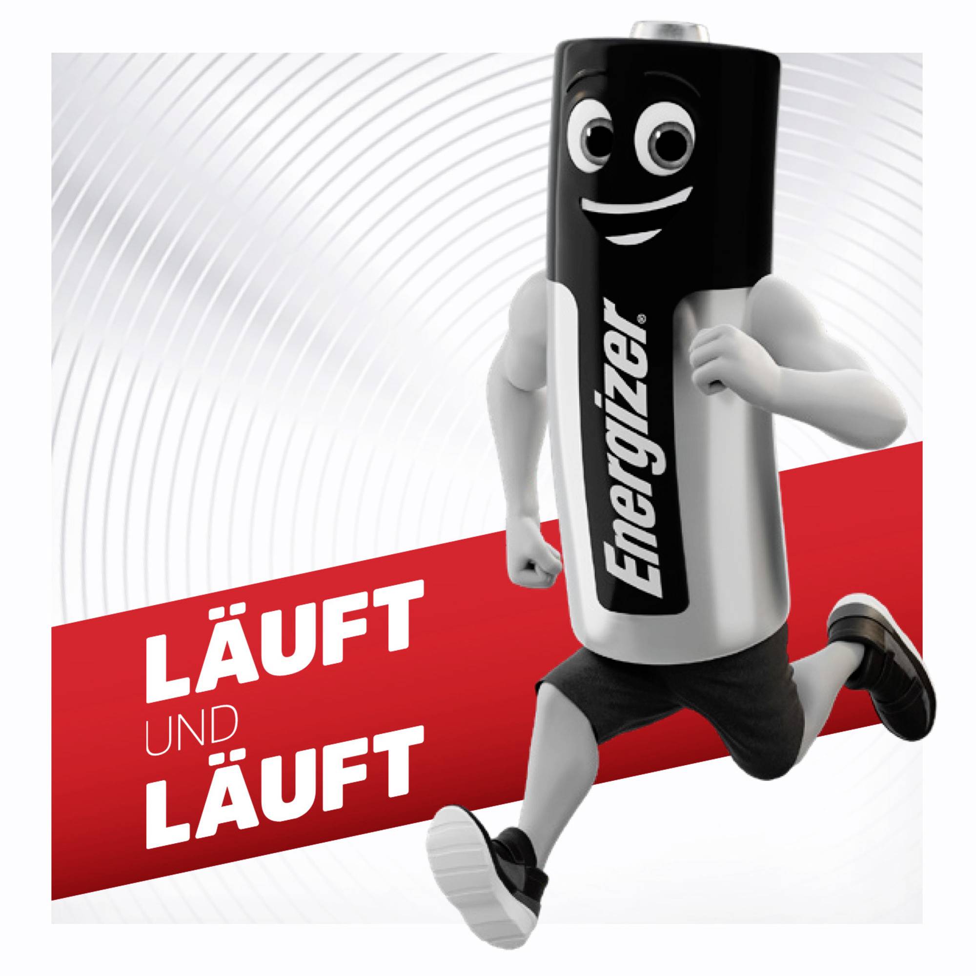 Une batterie anthropomorphe de la marque 'Energizer' court joyeusement. Texte : 'Qui dure et dure' sur une bande rouge en arrière-plan.