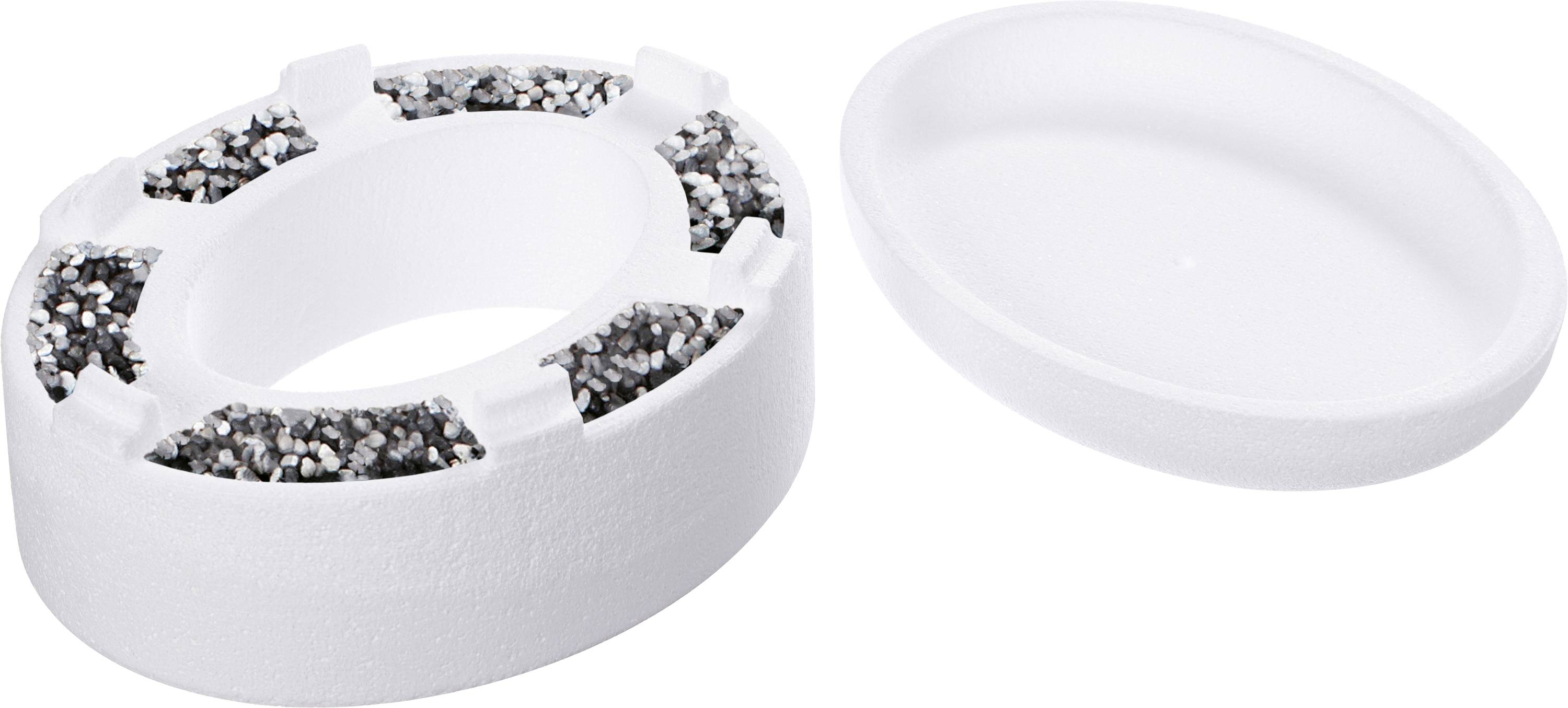 Un détecteur de fumée blanc, rond, avec un design texturé et un couvercle amovible placé à côté de lui.