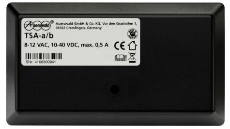 Appareil noir avec étiquette : 'Auerswald GmbH & Co. KG', 'TSA-a/b', '8-12 VAC, 10-40 VDC, max. 0,5 A', numéro de série.