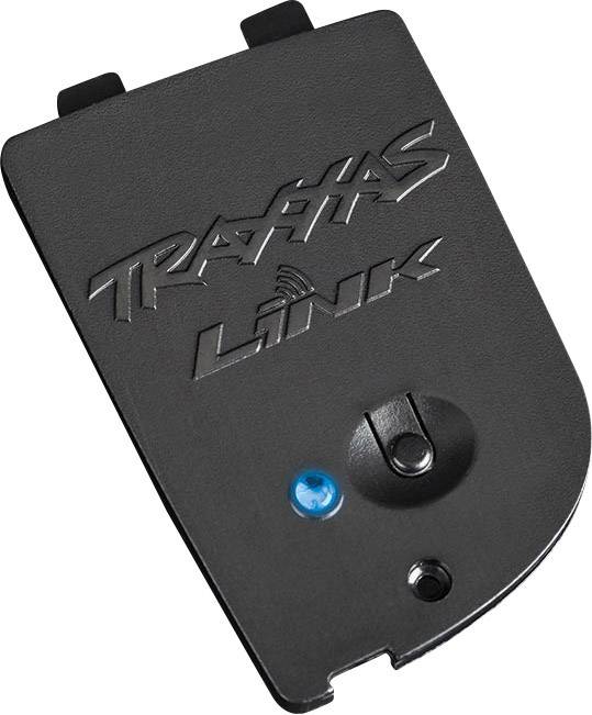 Dispositif électronique noir en plastique portant l'inscription 'Traxxas Link', avec un voyant LED bleu et des éléments de fixation. Accessoire électronique.