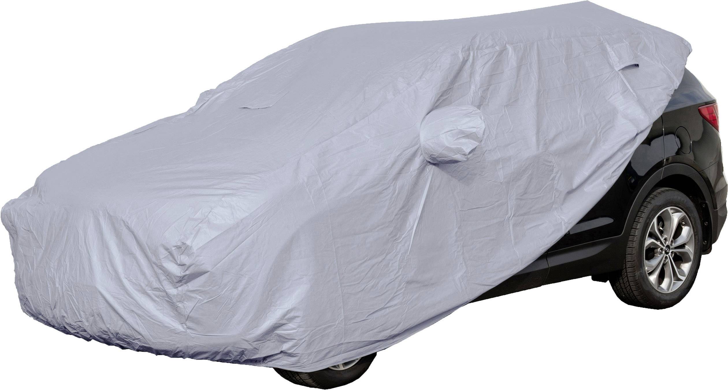 Une voiture noire est presque entièrement recouverte d'une bâche grise. Seules les roues et une partie de l'arrière sont visibles.