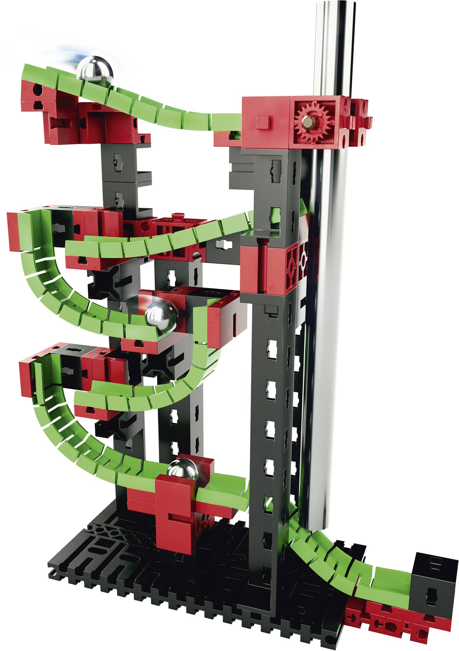 Circuit de billes en plastique avec des rails rouges et verts sur un support noir. Les billes roulent sur des chemins sinueux vers le bas.