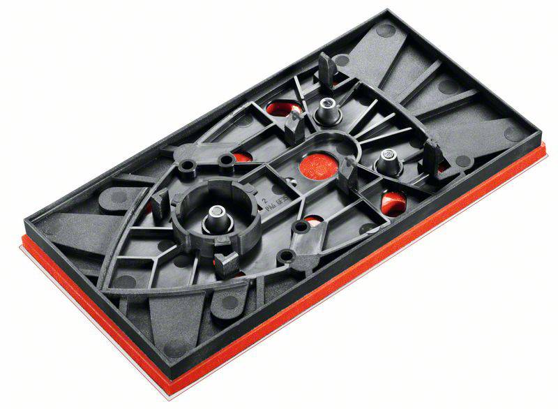 Pièce rectangulaire en plastique noir et rouge avec plusieurs découpes et points de fixation, probablement un composant mécanique.