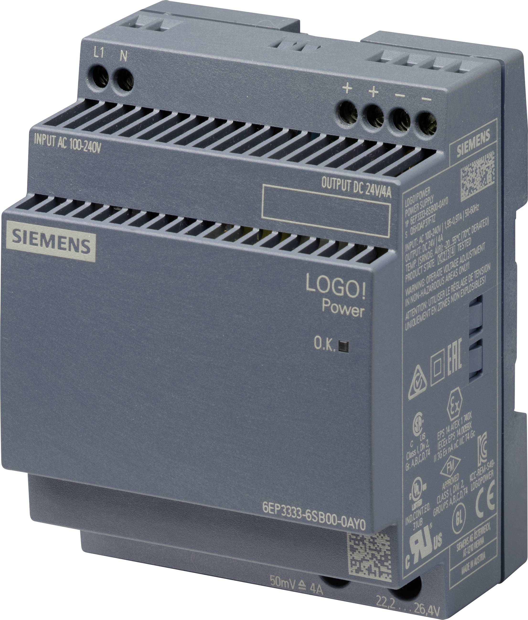 Un dispositif d'alimentation électrique industriel gris, marqué avec le 'Logo SIEMENS ! Power'. Il a des spécifications d'entrée et de sortie imprimées dessus.