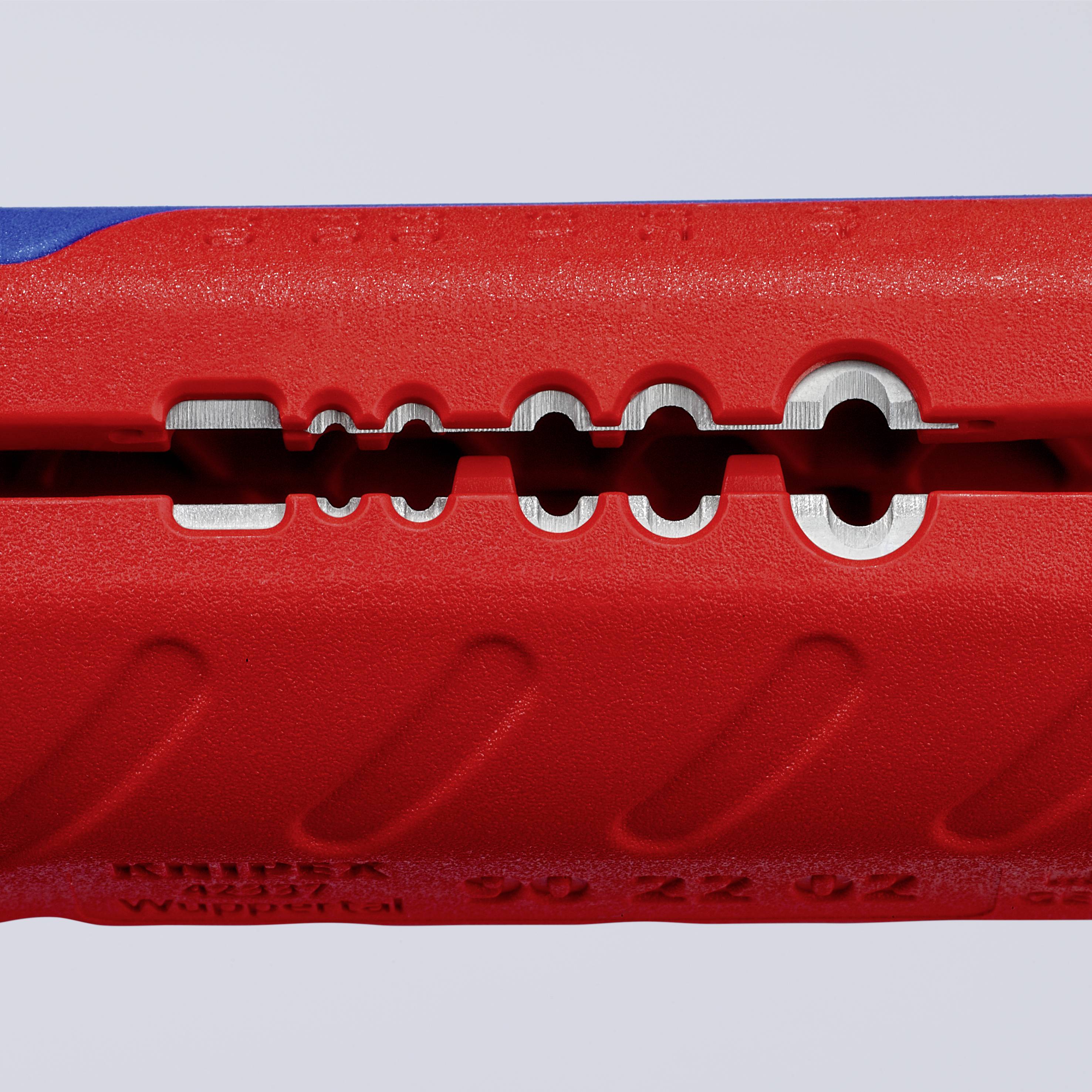 Un outil de préhension rouge avec des découpes et un design structuré.