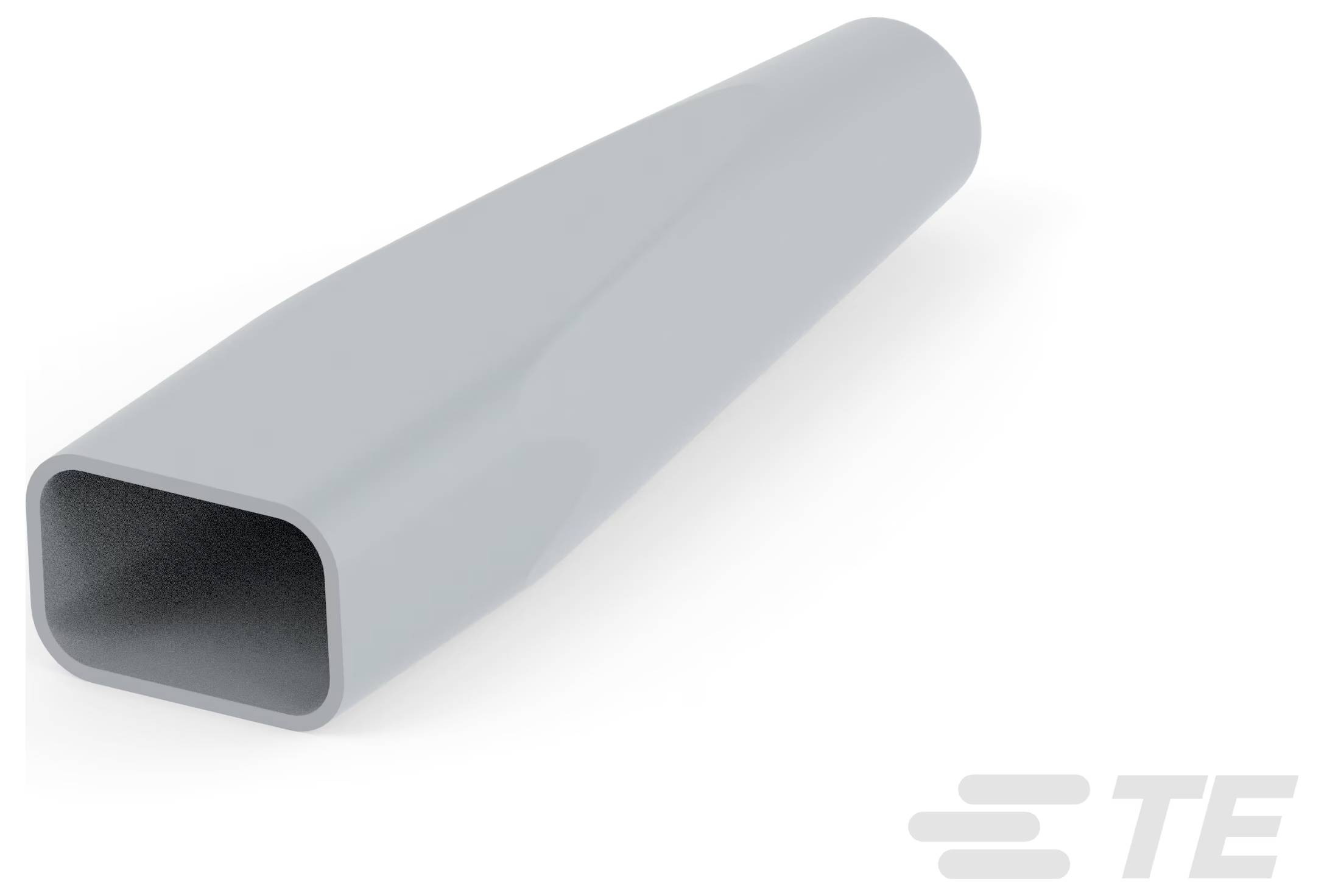 A close-up of a gray rectangular connector or sleeve with a hollow interior, angled slightly upward.