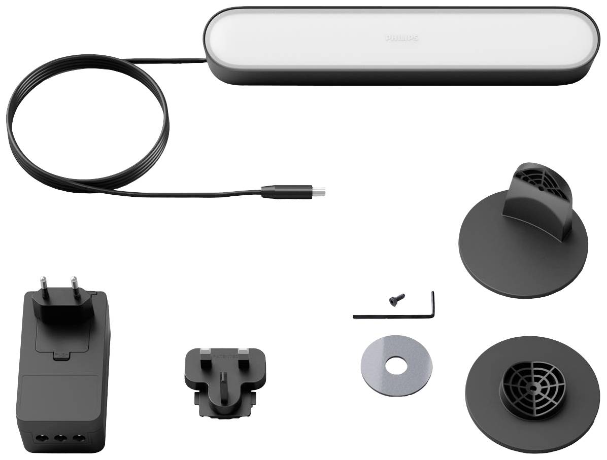 Ensemble d'accessoires avec barre LED, adaptateur secteur, supports de fixation et outils de montage. Idéal pour l'installation d'un éclairage d'ambiance.