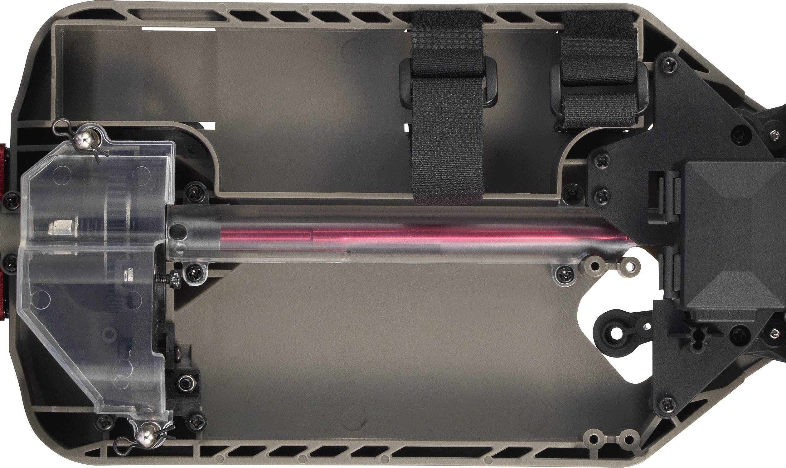 Vue intérieure d'un châssis de véhicule télécommandé avec des détails sur l'installation électronique, montrant le cheminement des câbles et les fixations.
