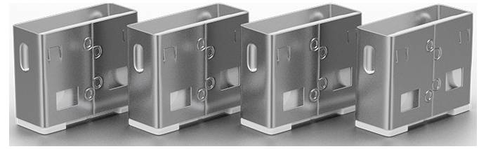 Quatre boîtes de rangement ou coffres en métal rectangulaires de couleur grise, présentés en rangée de gauche à droite, chacun avec un loquet frontal et une poignée latérale.