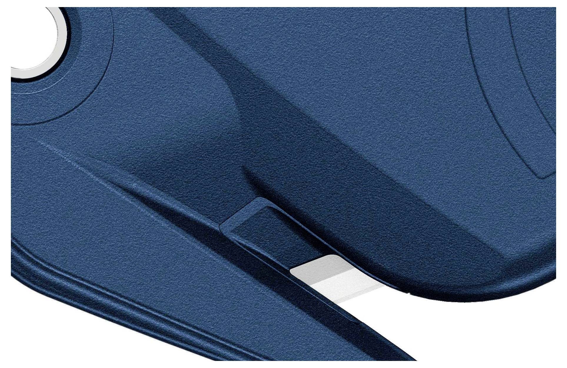 Un objet bleu structuré avec des courbes et des arêtes, probablement une partie d'un boîtier ou d'un couvercle, est représenté.