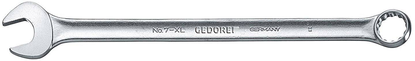 Une clé à molette en argent avec une extrémité ouverte et une extrémité à anneau, gravée du logo 'GEDORE', est posée horizontalement.
