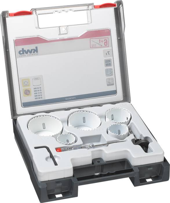 Coffret de couronnes de forage en métal dans un étui en plastique ouvert. Contient différentes couronnes de forage et accessoires, adapté pour un perçage précis.