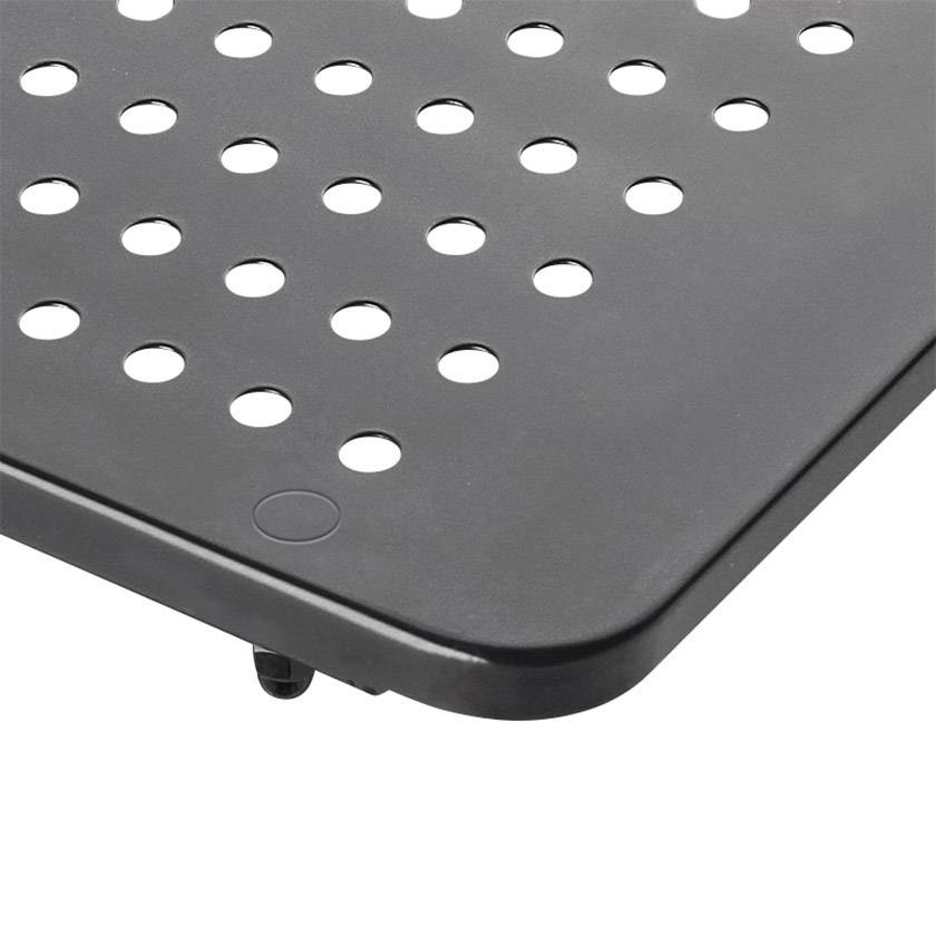 Une surface noire rectangulaire percée de trous ronds régulièrement répartis, probablement un élément d'un meuble ou d'un appareil.