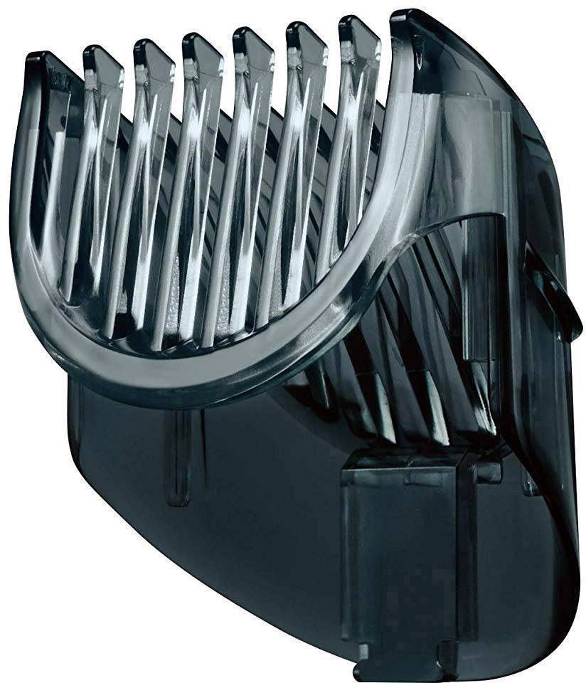Embout en plastique à dents de peigne, probablement destiné à un coupe-cheveux ou à un tondeuse à barbe, permettant de régler la longueur de coupe.