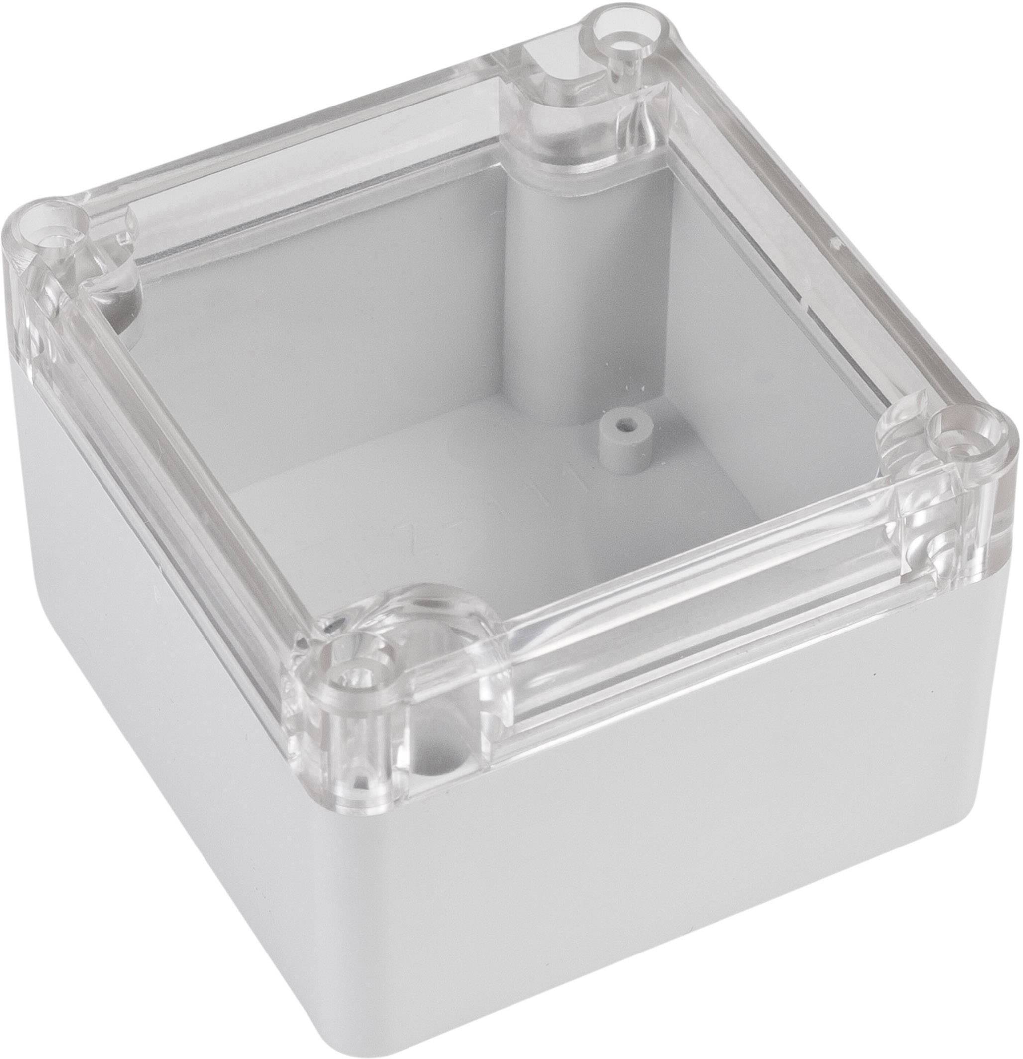 Boîtier rectangulaire en plastique gris avec couvercle transparent. Adapté au stockage ou à la protection de petits composants électroniques.