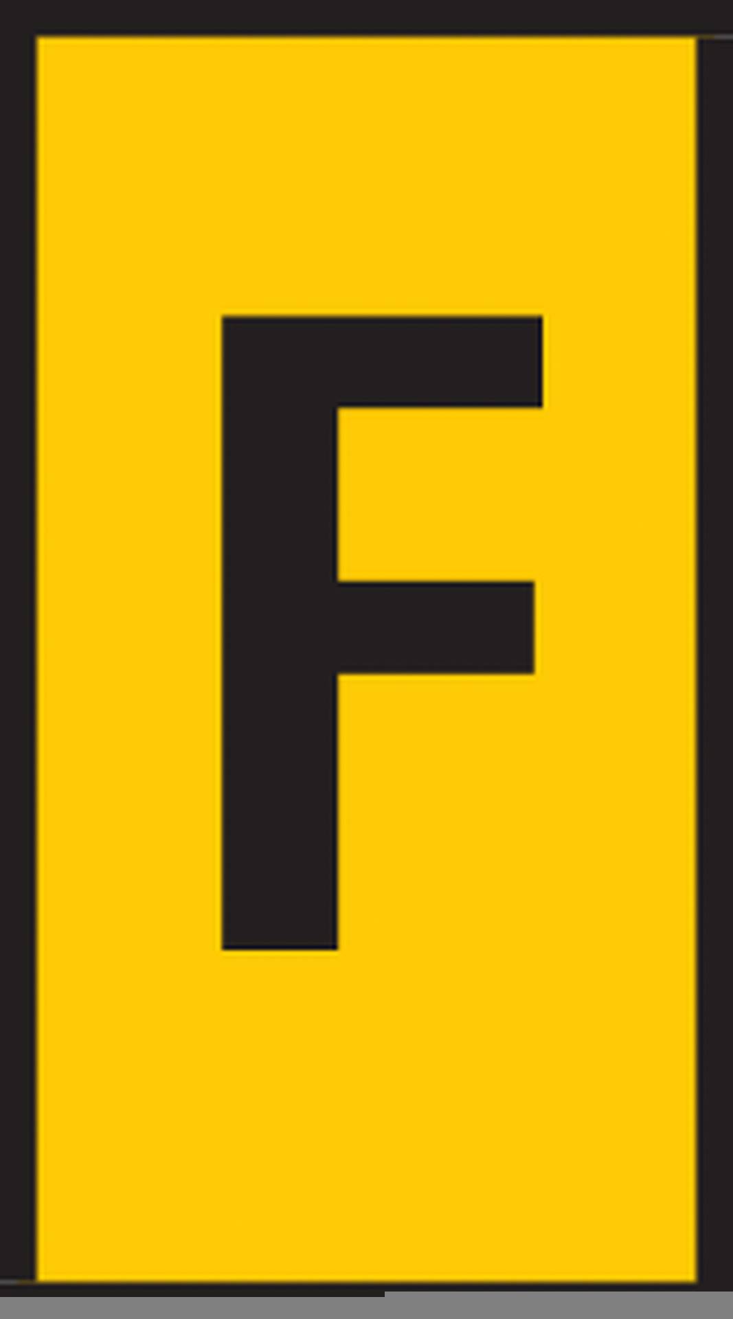 Panneau jaune avec la lettre noire 'F' au centre, symbolisant souvent un endroit ou un espace spécifique.