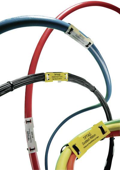 Câbles munis d'étiquettes de différentes couleurs et épaisseurs, identifiés par des informations techniques spécifiques.