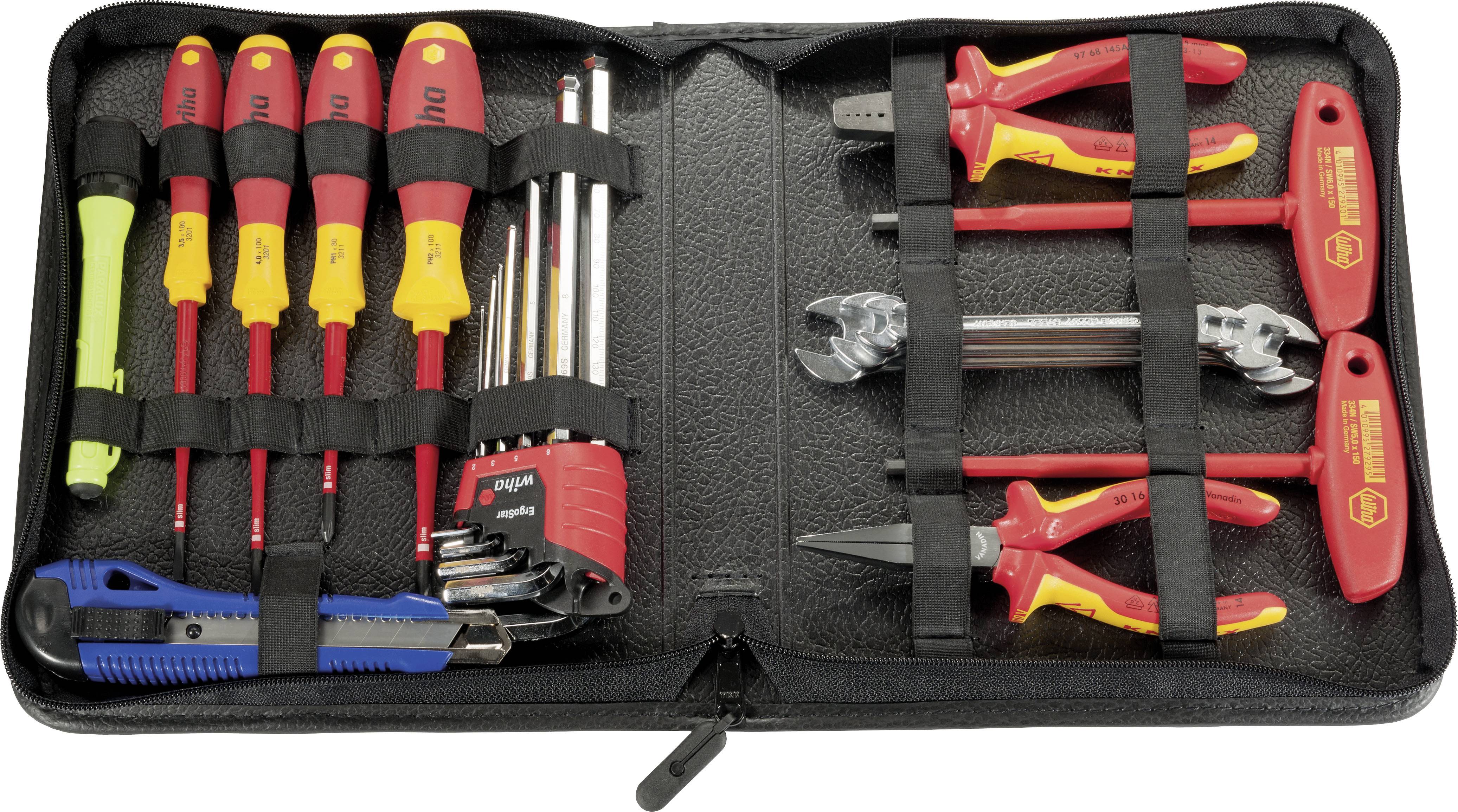 Un ensemble d'outils ouvert dans un sac montre divers tournevis, clés hexagonales, un cutter et des pinces avec des poignées rouges et jaunes.