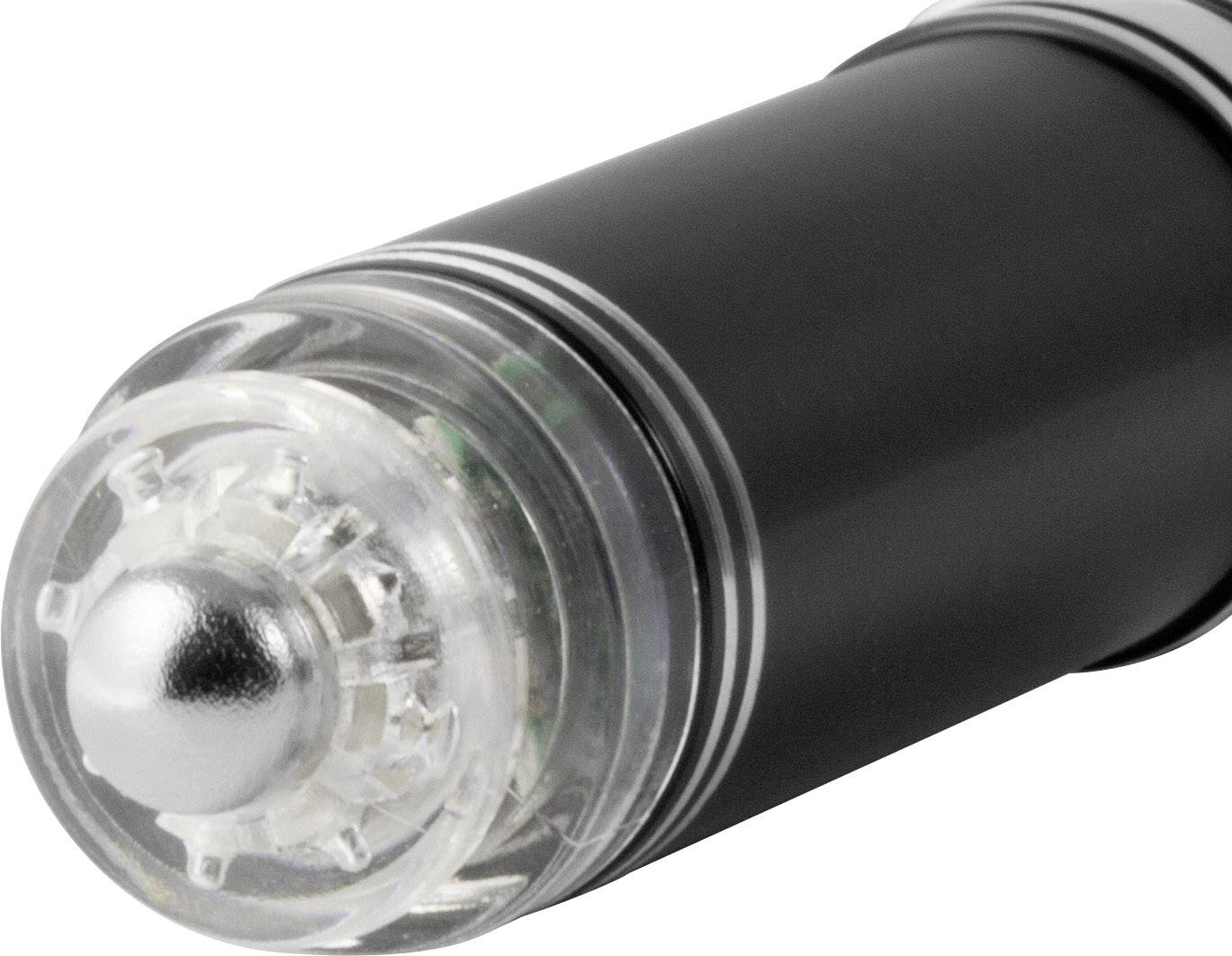 Un stylo noir avec un capuchon transparent et un embout argenté repose sur une surface. Le stylo présente un design moderne.